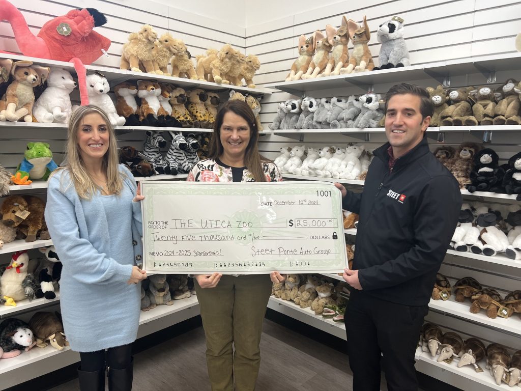 Carly Steet Mathias, right; Andria Heath, Utica Zoo Director, middle; Joe Steet Jr., right, presenting the Utica Zoo with their $25,000 donation