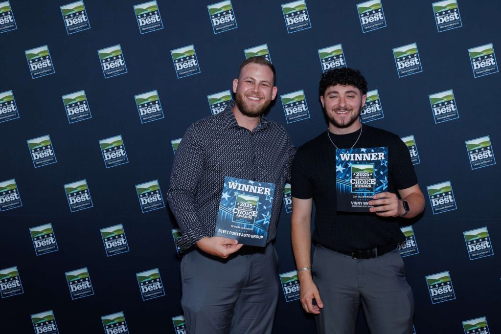 Dan DeLuke, Social Media Coordinator for the Auto Group and Vinny Ward, accepting the awards for Best New Car Dealer, and Best Salesperson
