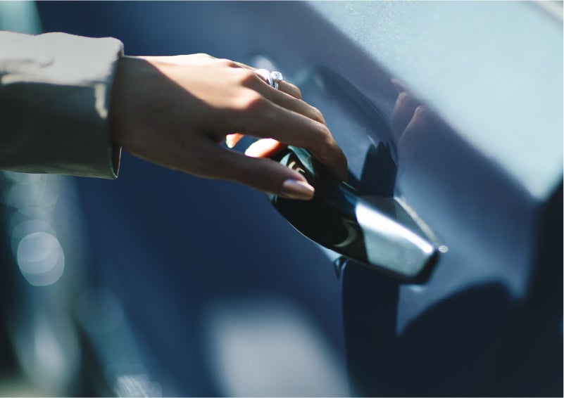 A hand gracefully grips the Light Touch Handle of a 2023 Lincoln Aviator® SUV to demonstrate its ease of use | Steet-Ponte Lincoln in Yorkville NY