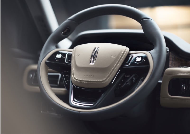 The intuitively placed controls of the steering wheel on a 2023 Lincoln Aviator® SUV | Steet-Ponte Lincoln in Yorkville NY