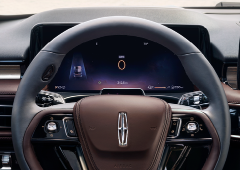 The steering wheel of 2025 Lincoln Aviator® SUV is shown with black and brown accents. | Steet-Ponte Lincoln in Yorkville NY