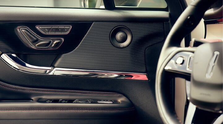 A Revel® audio speaker is shown in the driver's side door of a 2025 Lincoln Corsair® SUV. | Steet-Ponte Lincoln in Yorkville NY