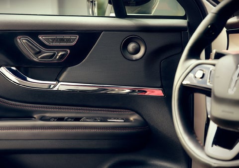 The driver of a 2024 Lincoln Corsair® SUV is shown selecting the drive mode. | Steet-Ponte Lincoln in Yorkville NY