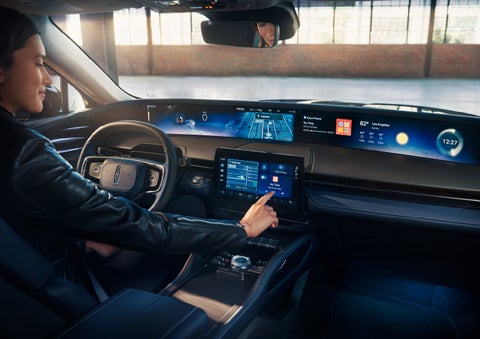 The driver of a 2025 Lincoln Nautilus® SUV interacts with the center touchscreen. | Steet-Ponte Lincoln in Yorkville NY