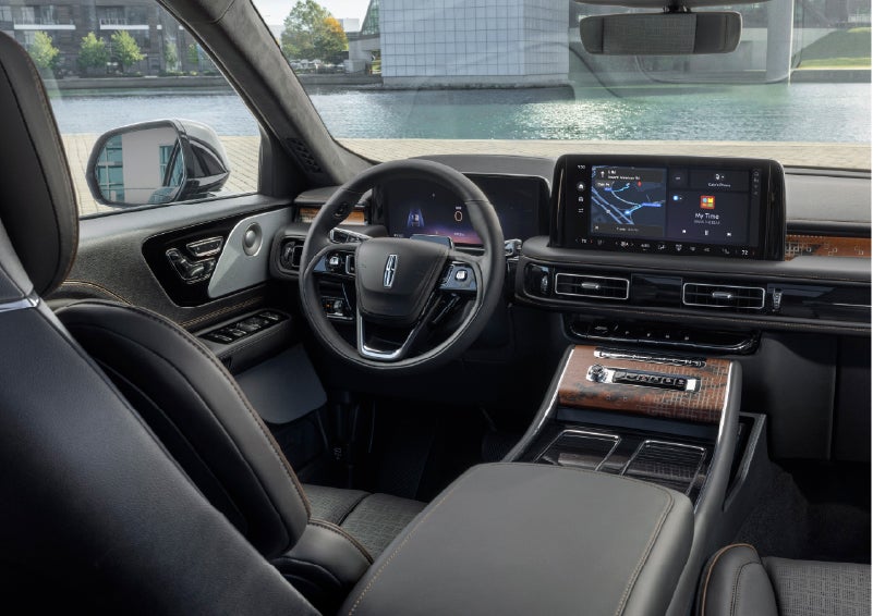 The interior of the 2026 Lincoln Aviator® SUV is shown parked with a view of a harbor through the windshield. | Steet-Ponte Lincoln in Yorkville NY