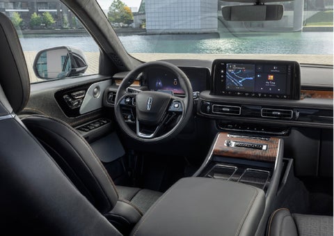 The interior of the 2026 Lincoln Aviator® SUV is shown parked with a view of a harbor through the windshield. | Steet-Ponte Lincoln in Yorkville NY