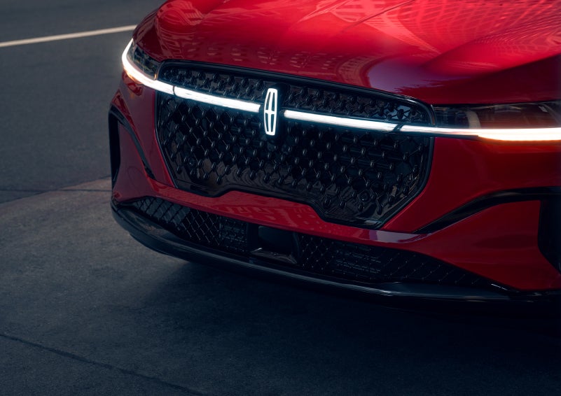 The available front LED light bar and center Lincoln Star logo glow at dusk. | Steet-Ponte Lincoln in Yorkville NY