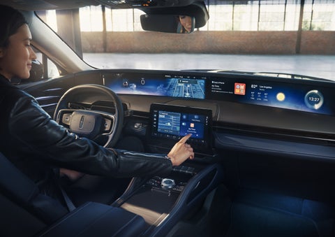The driver of a 2026 Lincoln Nautilus® SUV interacts with the center touchscreen. | Steet-Ponte Lincoln in Yorkville NY