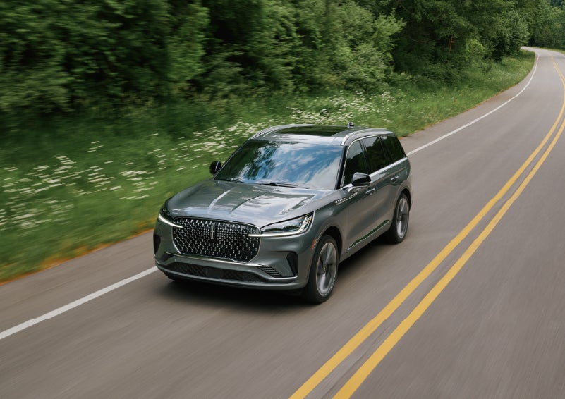 A 2027 Lincoln Aviator® SUV is being driven down a road. | Steet-Ponte Lincoln in Yorkville NY