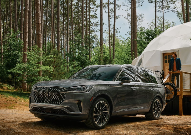 A 2027 Lincoln Aviator® is parked next to a high end glamping site. | Steet-Ponte Lincoln in Yorkville NY