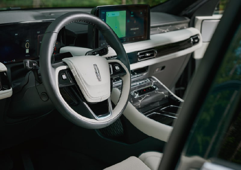 The leather-trimmed steering wheel of a 2027 Lincoln Aviator® Black Label™ SUV. | Steet-Ponte Lincoln in Yorkville NY