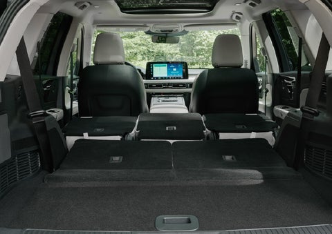 A rear to front view of the interior of a 2027 Lincoln Aviator® Black Label™ SUV shows the third and second rows folded flat | Steet-Ponte Lincoln in Yorkville NY